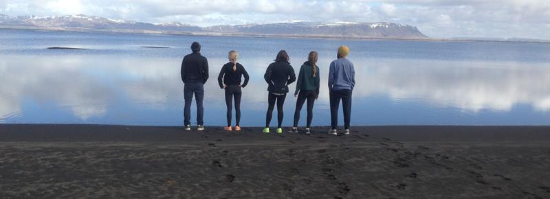 students standing by water