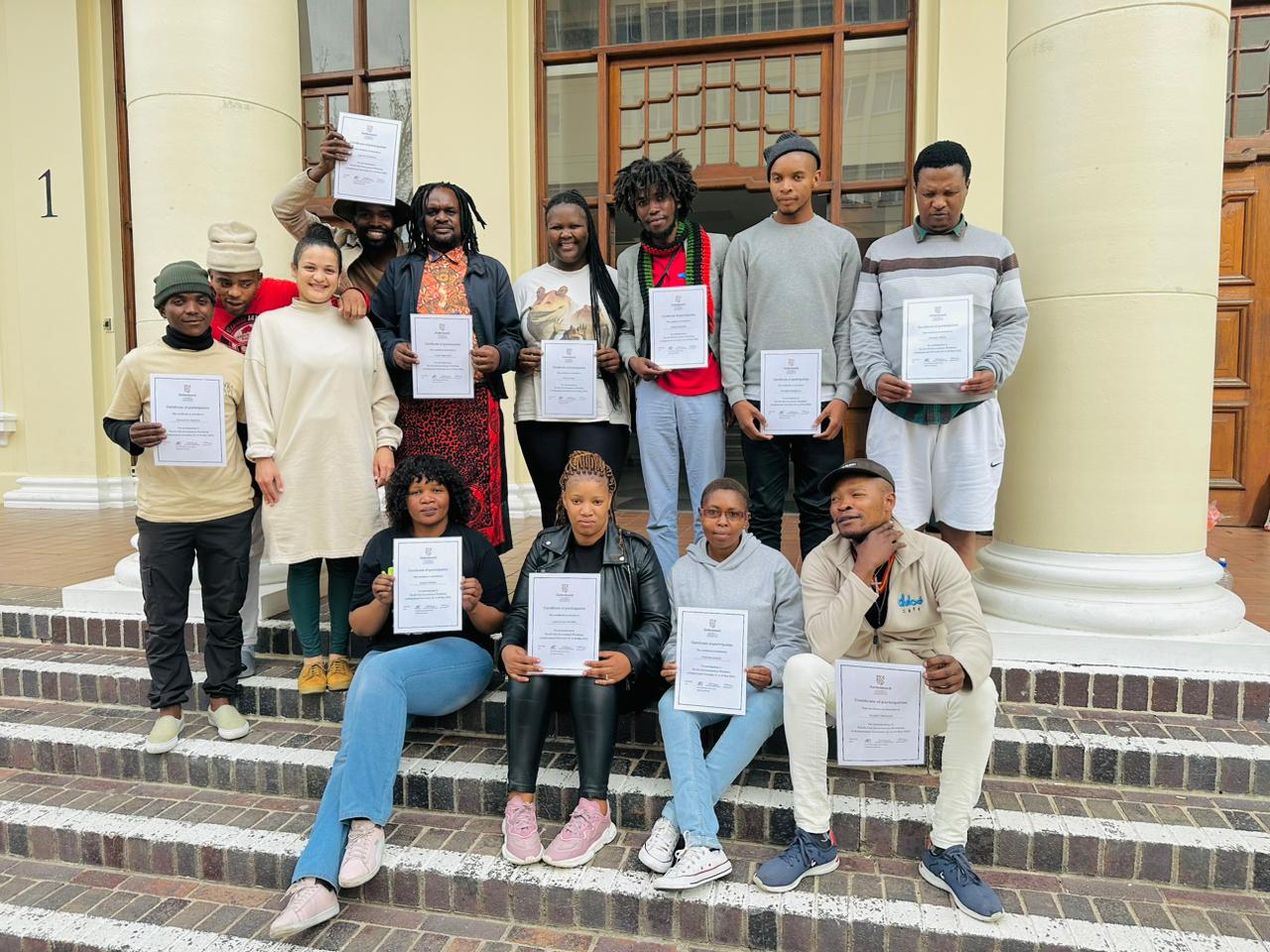 Small business owners with their certificates of completion